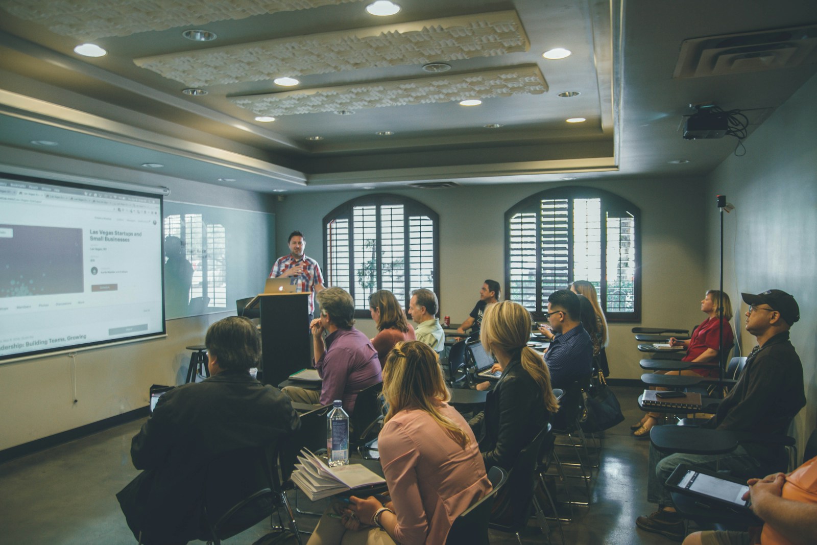 An instructor teaching a classroom of adult students